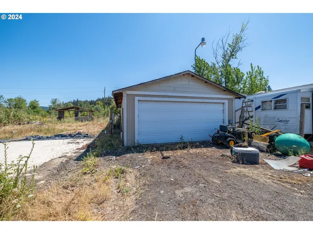 a backyard of a house with outdoor seating