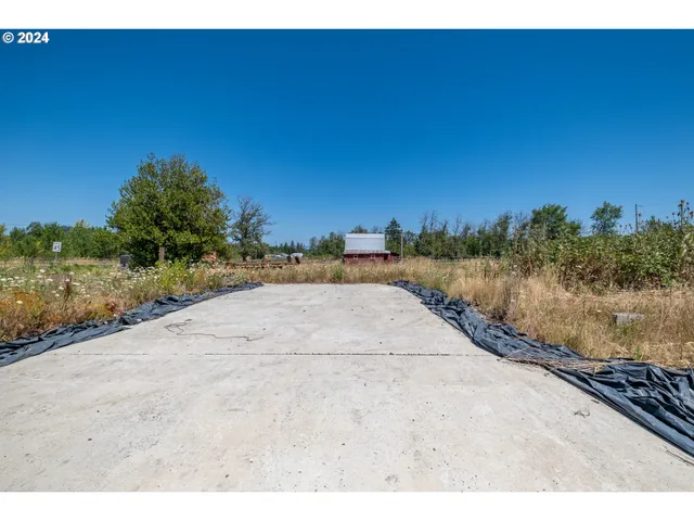 a view of a road with a building in the background