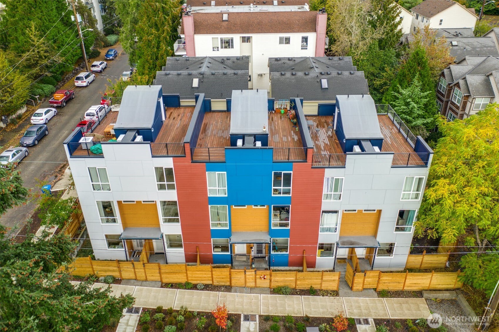 an aerial view of residential houses with yard