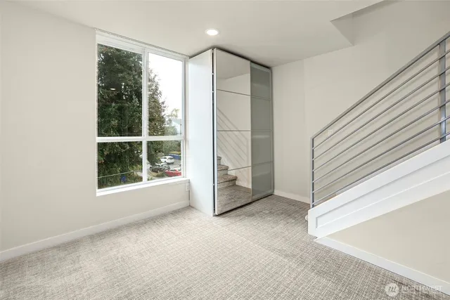 a view of a bathroom with a walk in closet and a bathroom