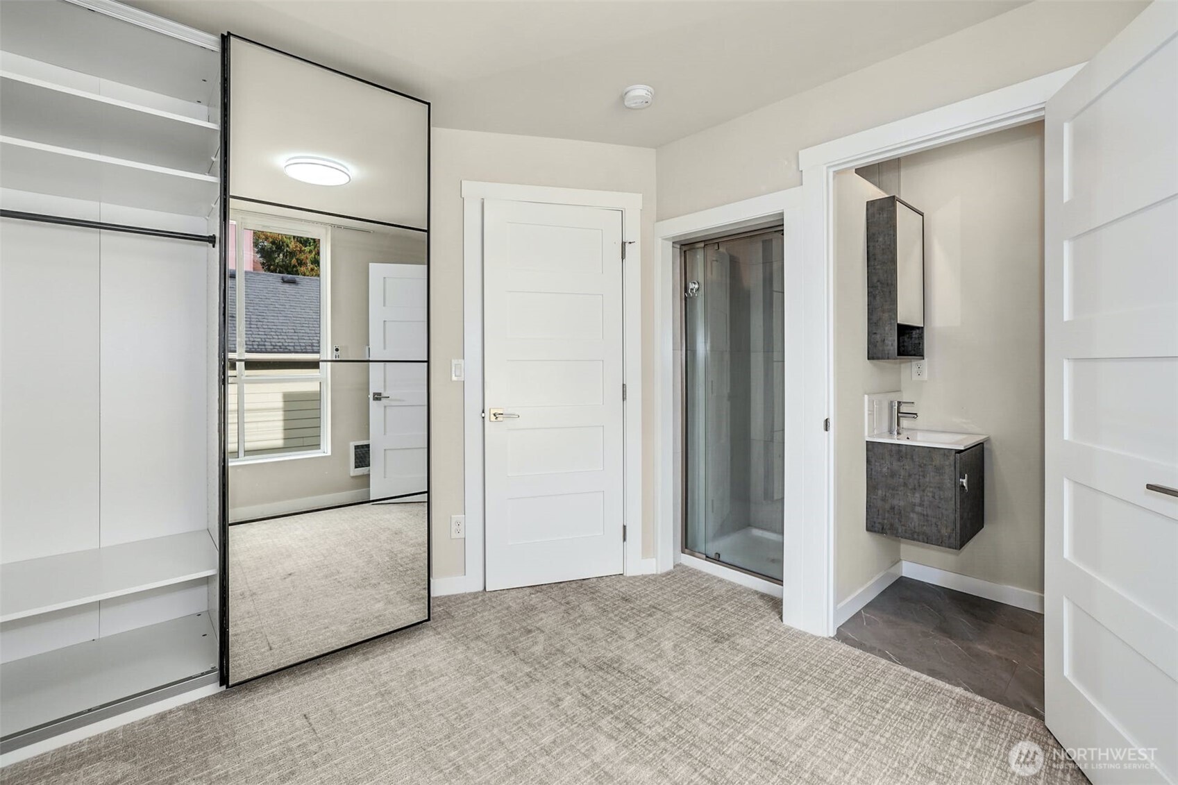 1400 North 95th Street Seattle, WA 98103 - Photo 17 of 27 a view of a bathroom with a walk in closet and a bathroom
