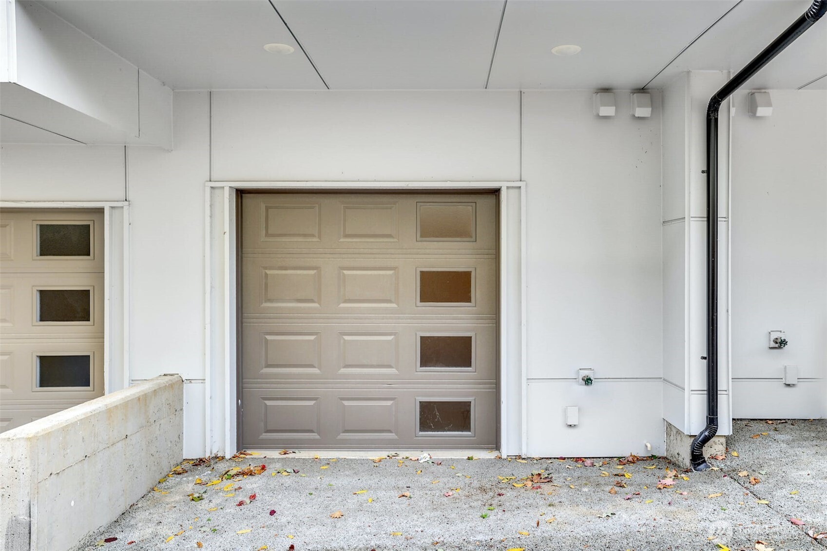 1400 North 95th Street Seattle, WA 98103 - Photo 20 of 27 a view of a hallway with wooden cabinet and a window