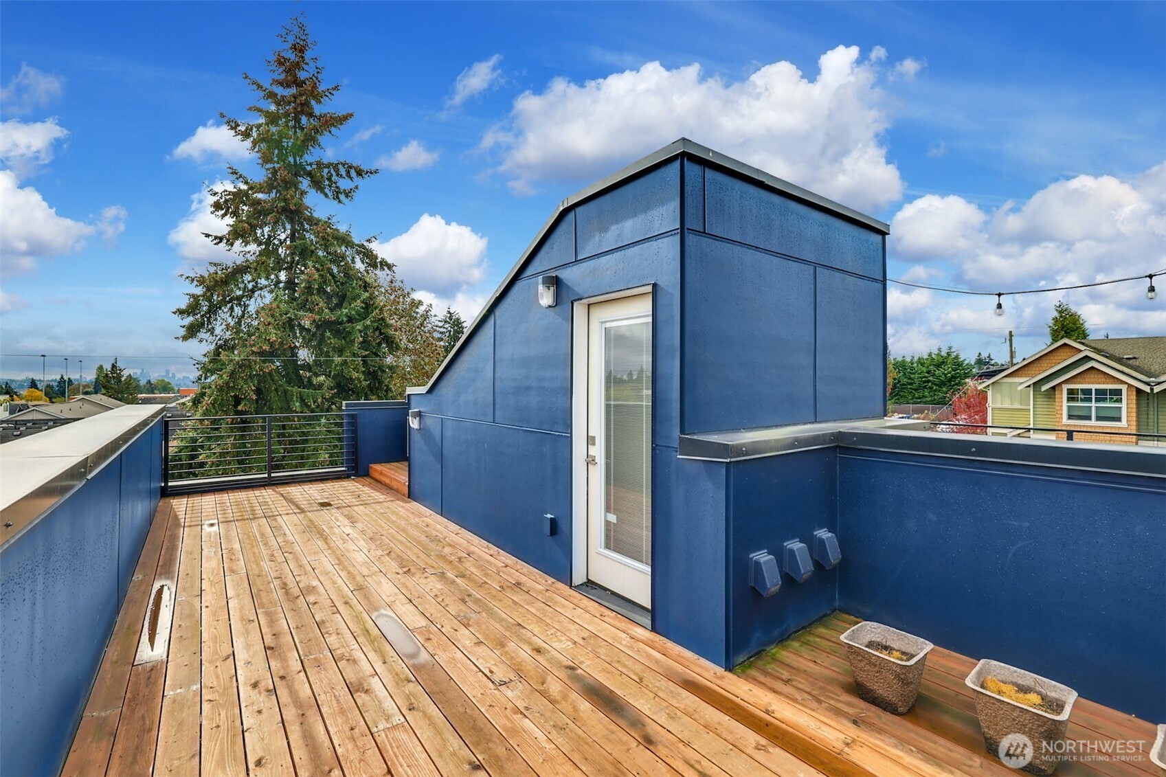1400 North 95th Street Seattle, WA 98103 - Photo 22 of 27 a backyard of a house with wooden floor