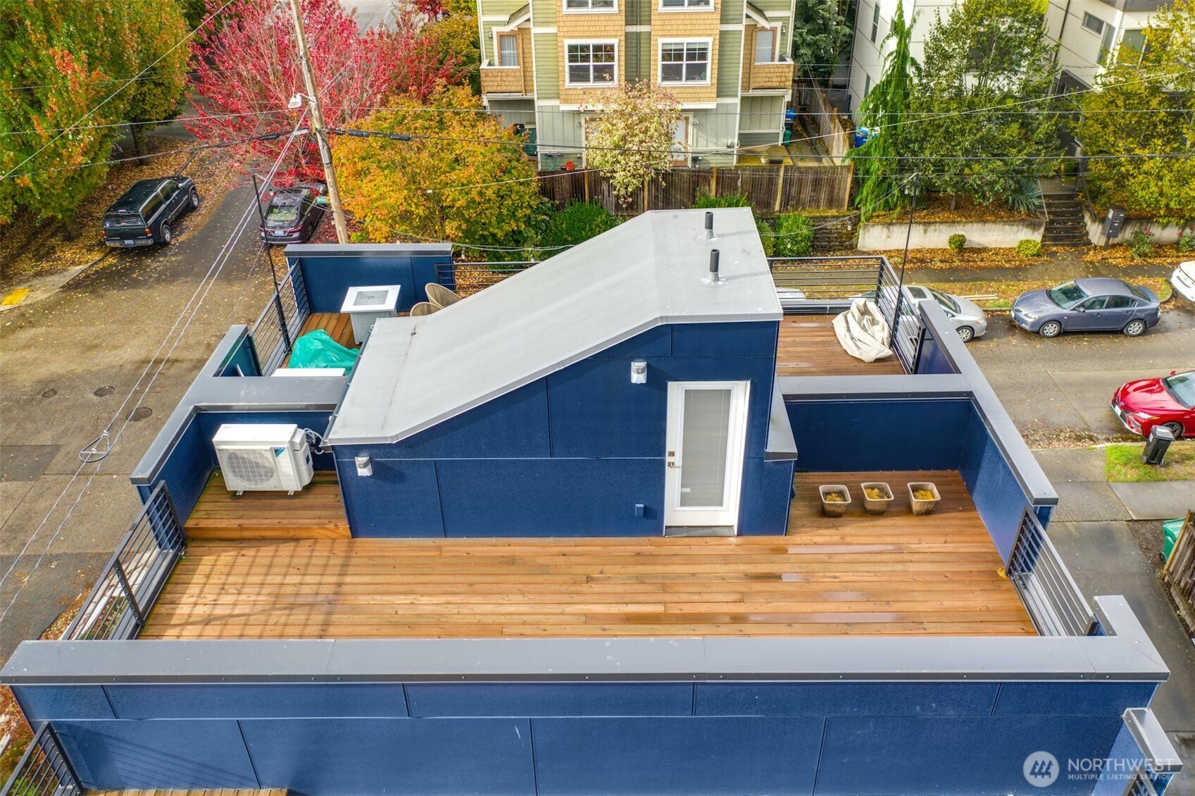 1400 North 95th Street Seattle, WA 98103 - Photo 26 of 27 a view of a patio with couches table and chairs and potted plants