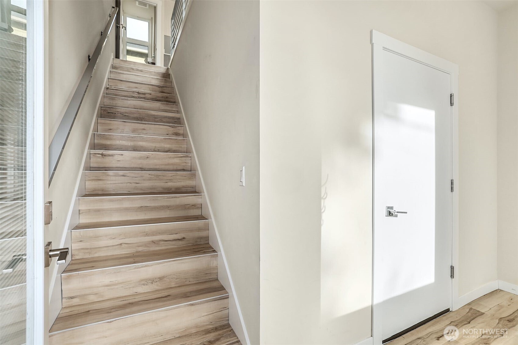 1400 North 95th Street Seattle, WA 98103 - Photo 7 of 27 a view of a hallway with wooden floor and entryway
