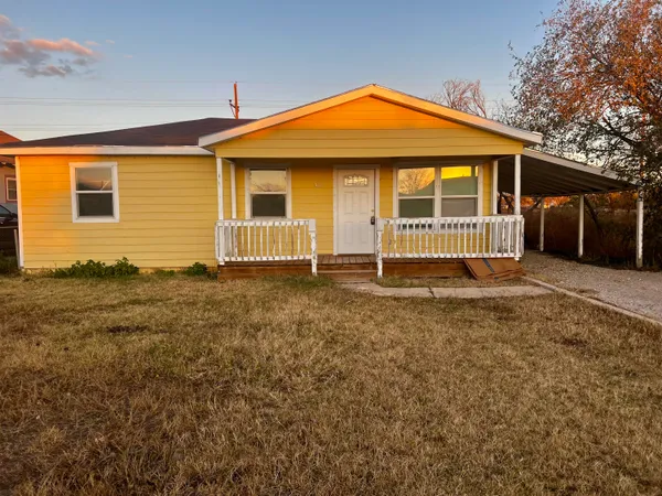 front view of a house with a yard