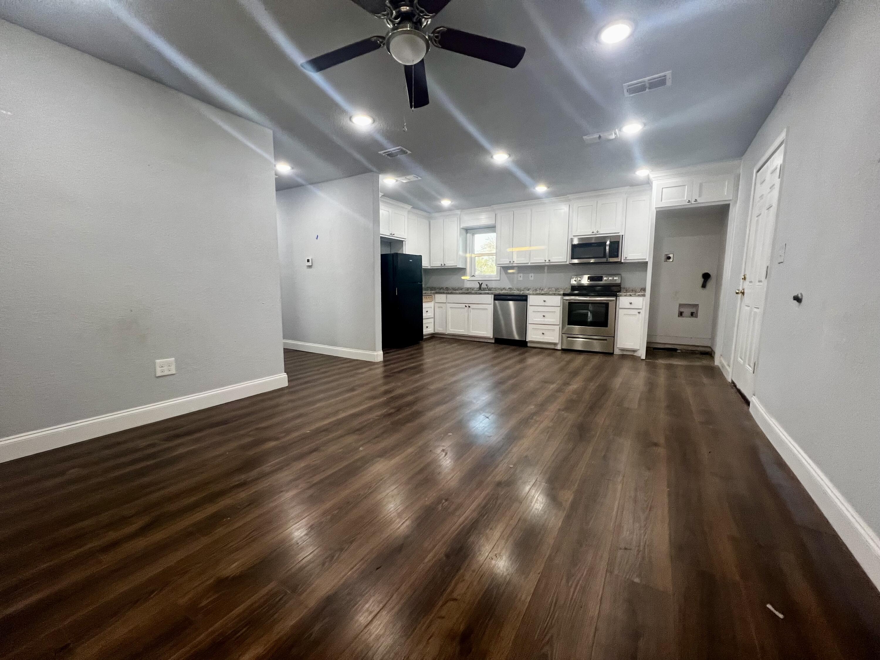 420 South 2nd Street Slaton, TX 79364 - Photo 2 of 9 Living/Kitchen