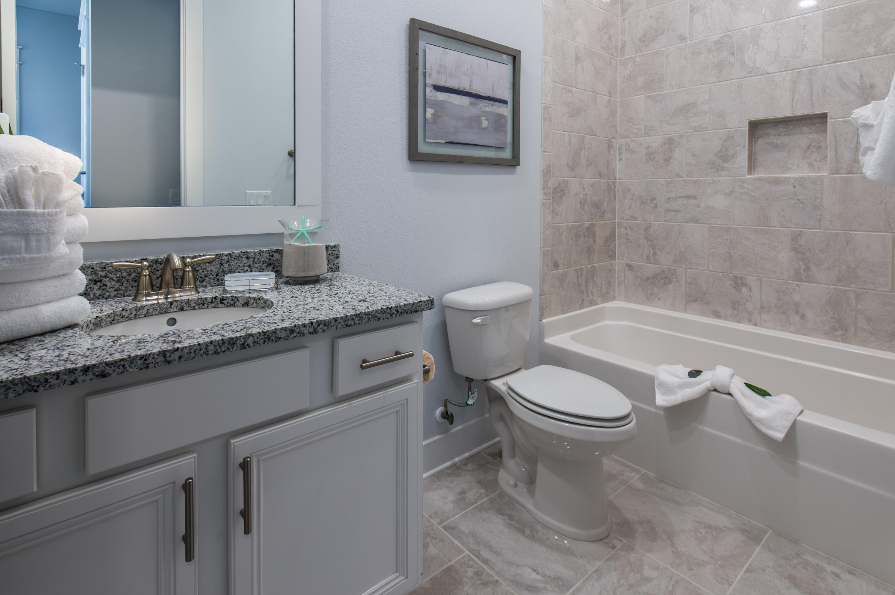 11 Pine Lands Loop, Unit 366 Inlet Beach, FL 32461 - Photo 22 of 29 a white toilet sitting next to a bathroom sink