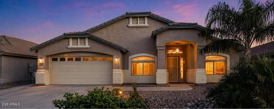 935 West Gascon Road San Tan Valley, AZ 85143 - Photo 1 of 43 a front view of a house with garden