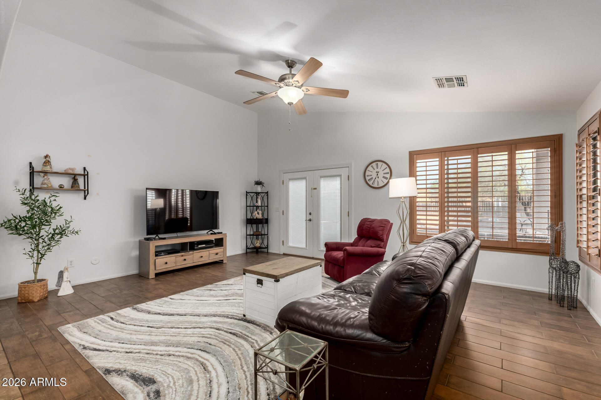 935 West Gascon Road San Tan Valley, AZ 85143 - Photo 11 of 43 a bedroom with furniture and a flat screen tv