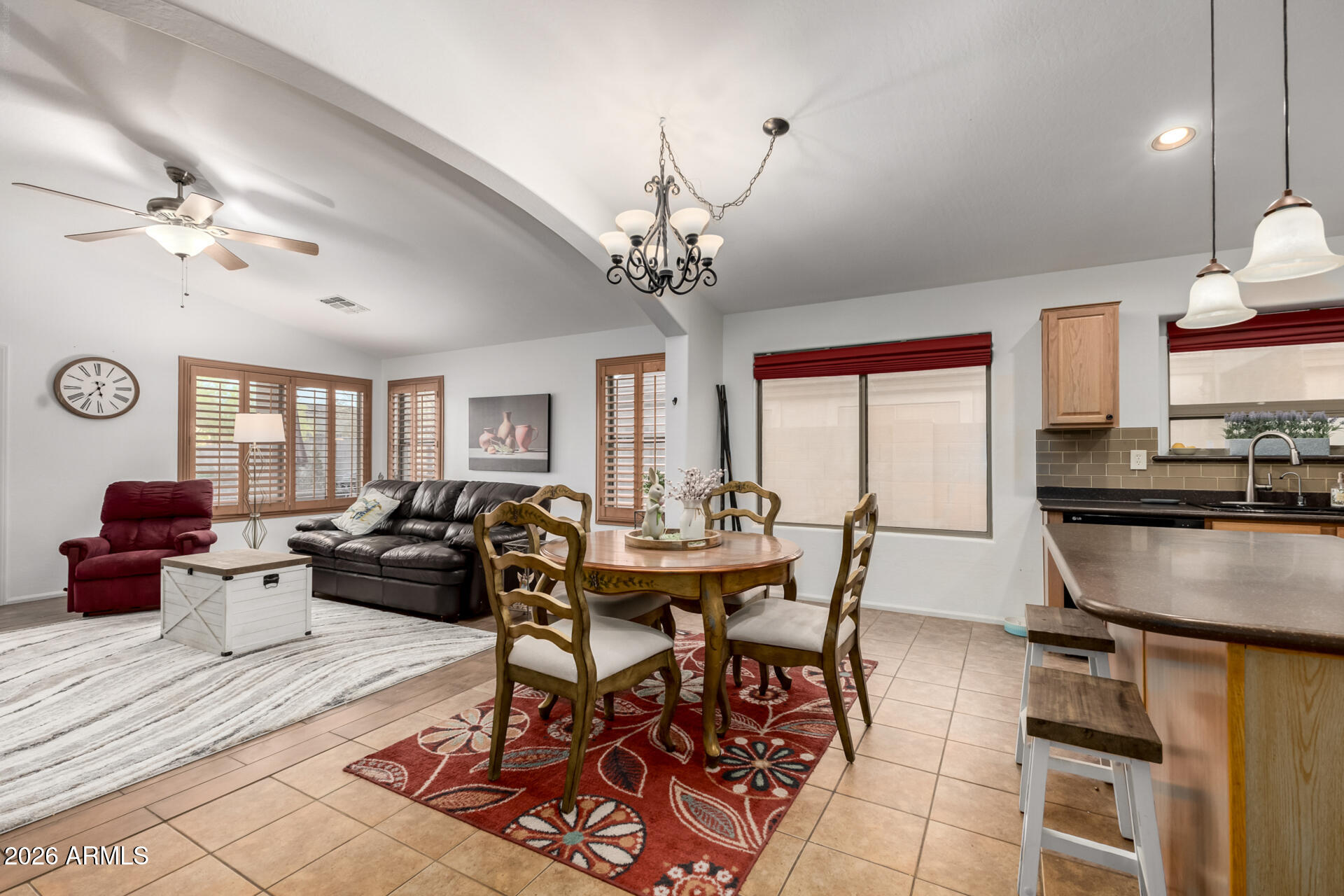 935 West Gascon Road San Tan Valley, AZ 85143 - Photo 13 of 43 a living room with fireplace furniture and a chandelier