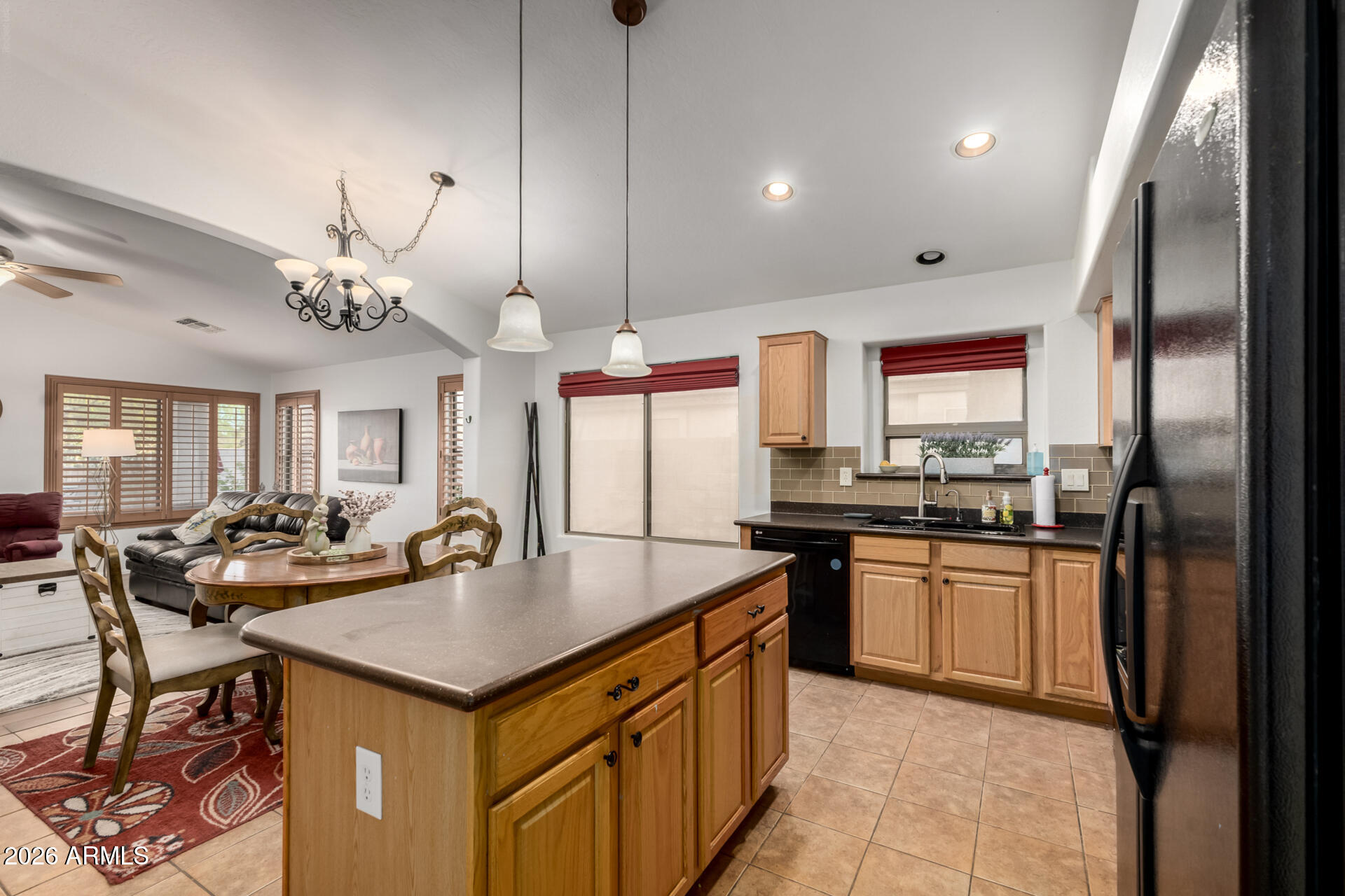 935 West Gascon Road San Tan Valley, AZ 85143 - Photo 15 of 43 a kitchen with stainless steel appliances granite countertop a sink a stove and a refrigerator