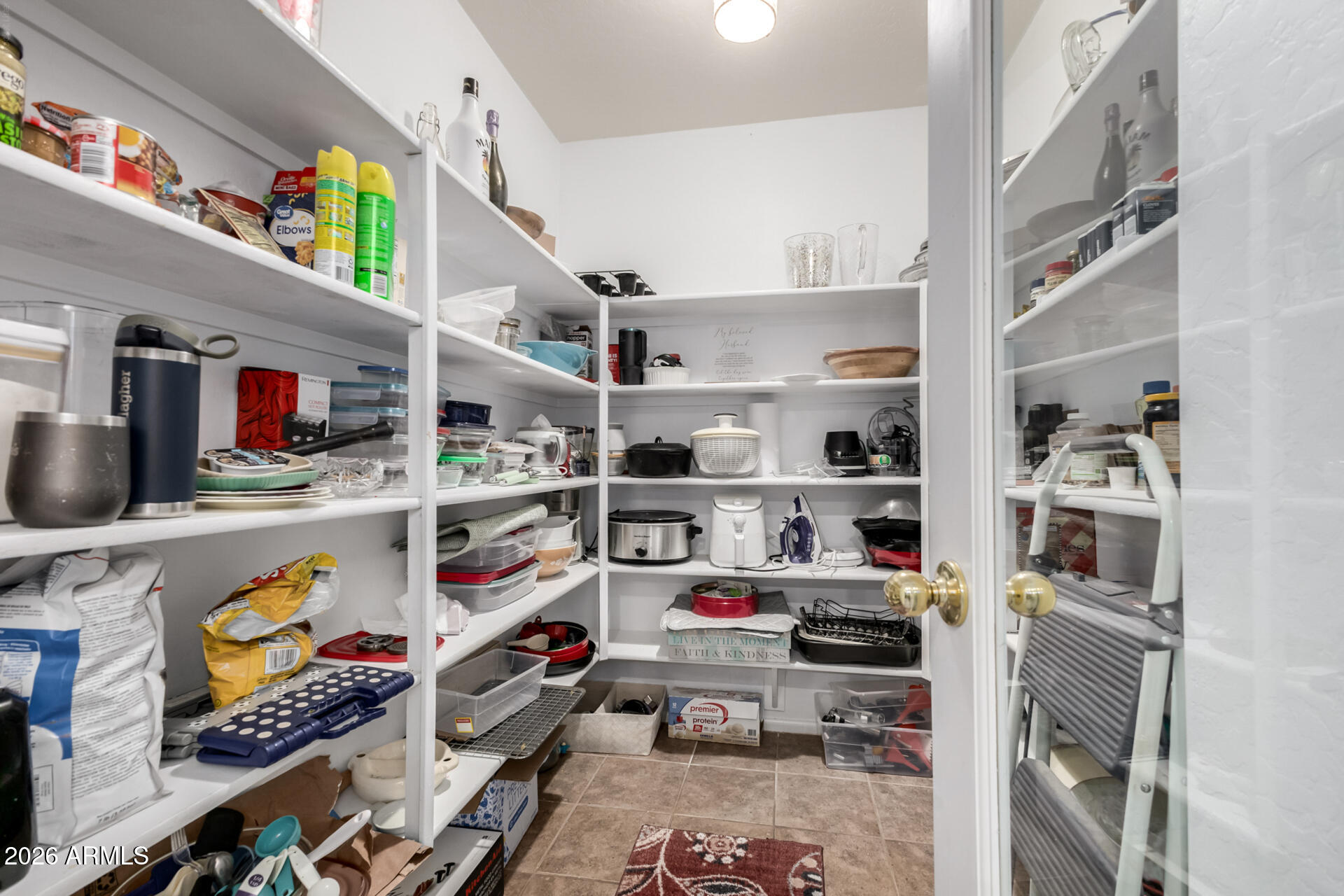 935 West Gascon Road San Tan Valley, AZ 85143 - Photo 17 of 43 a view of walk in closet with clothes and shoes