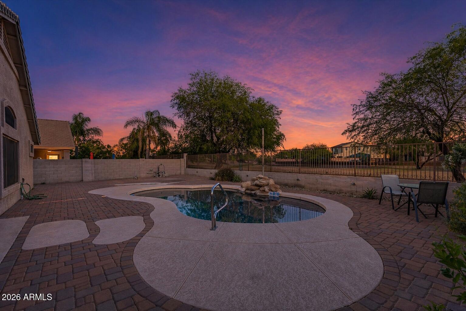 935 West Gascon Road San Tan Valley, AZ 85143 - Photo 2 of 43 a view of a swimming pool with a yard
