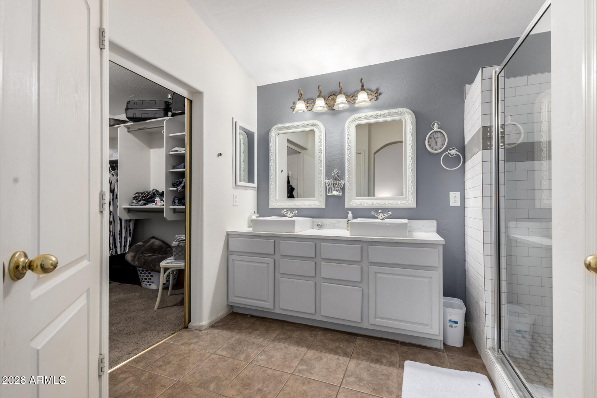 935 West Gascon Road San Tan Valley, AZ 85143 - Photo 21 of 43 a bathroom with a double vanity sink and a mirror
