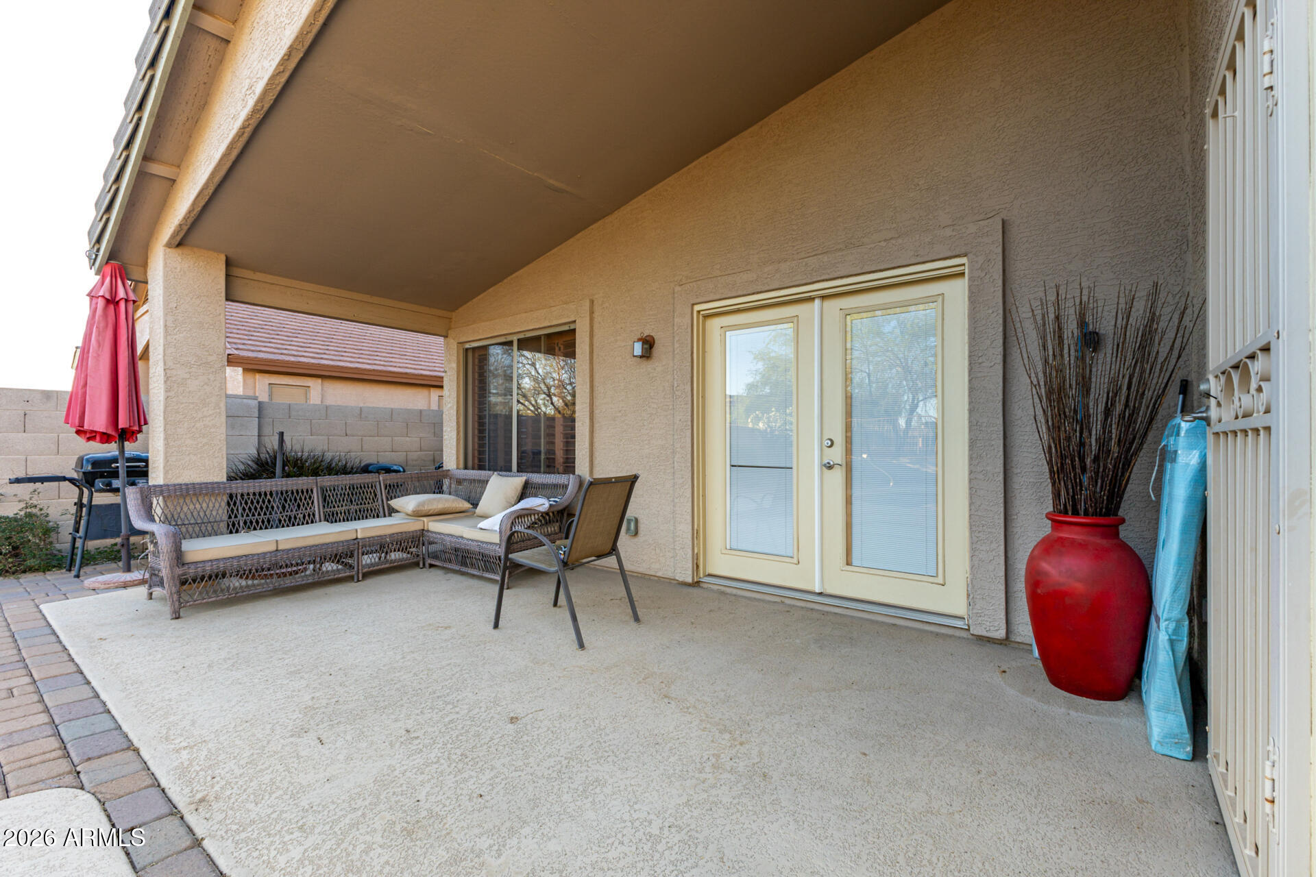 935 West Gascon Road San Tan Valley, AZ 85143 - Photo 31 of 43 a living room with furniture and a floor to ceiling window