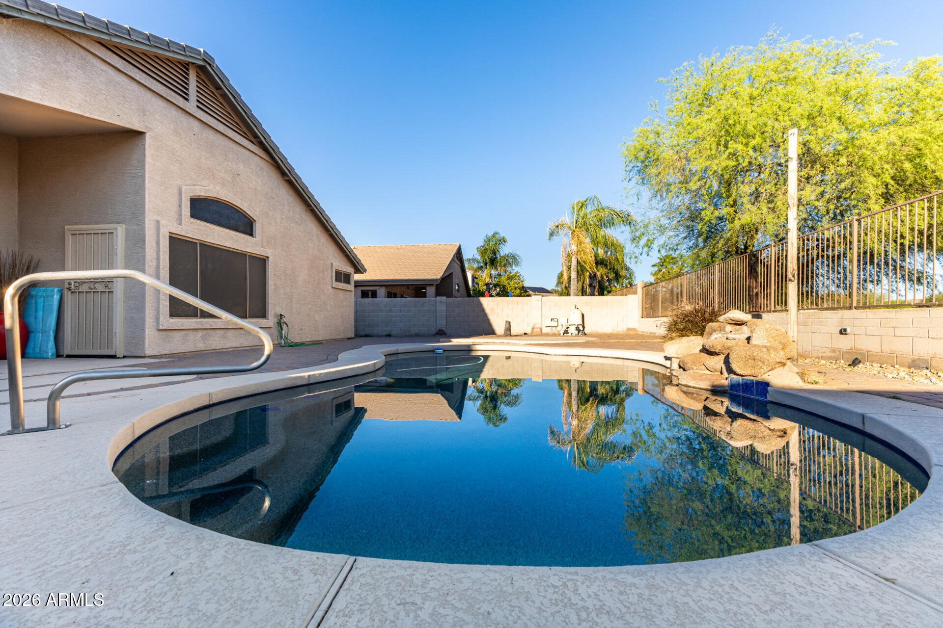 935 West Gascon Road San Tan Valley, AZ 85143 - Photo 33 of 43 a view of a swimming pool with a patio