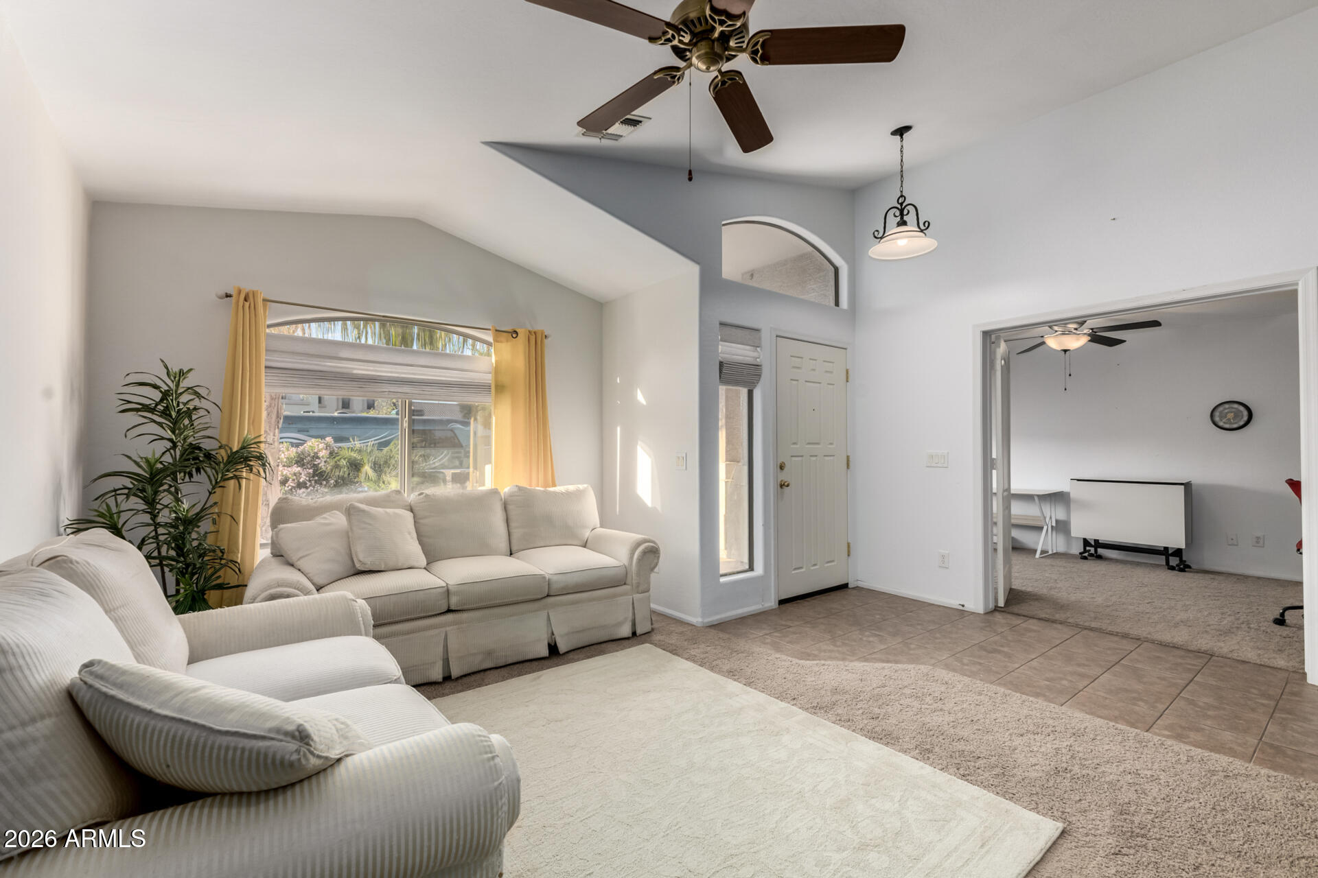 935 West Gascon Road San Tan Valley, AZ 85143 - Photo 6 of 43 a living room with furniture and a ceiling fan