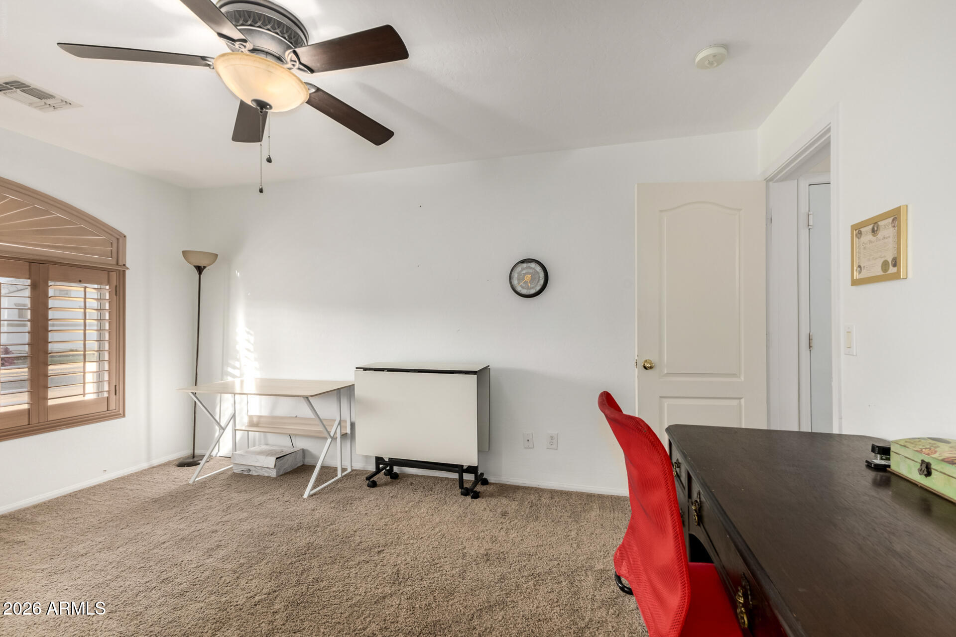 935 West Gascon Road San Tan Valley, AZ 85143 - Photo 7 of 43 a view of a workspace with furniture and a window