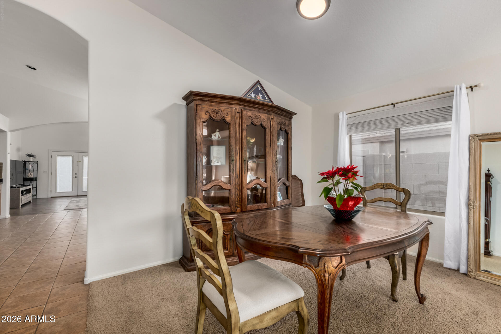 935 West Gascon Road San Tan Valley, AZ 85143 - Photo 9 of 43 a view of a dining room with furniture and wooden floor
