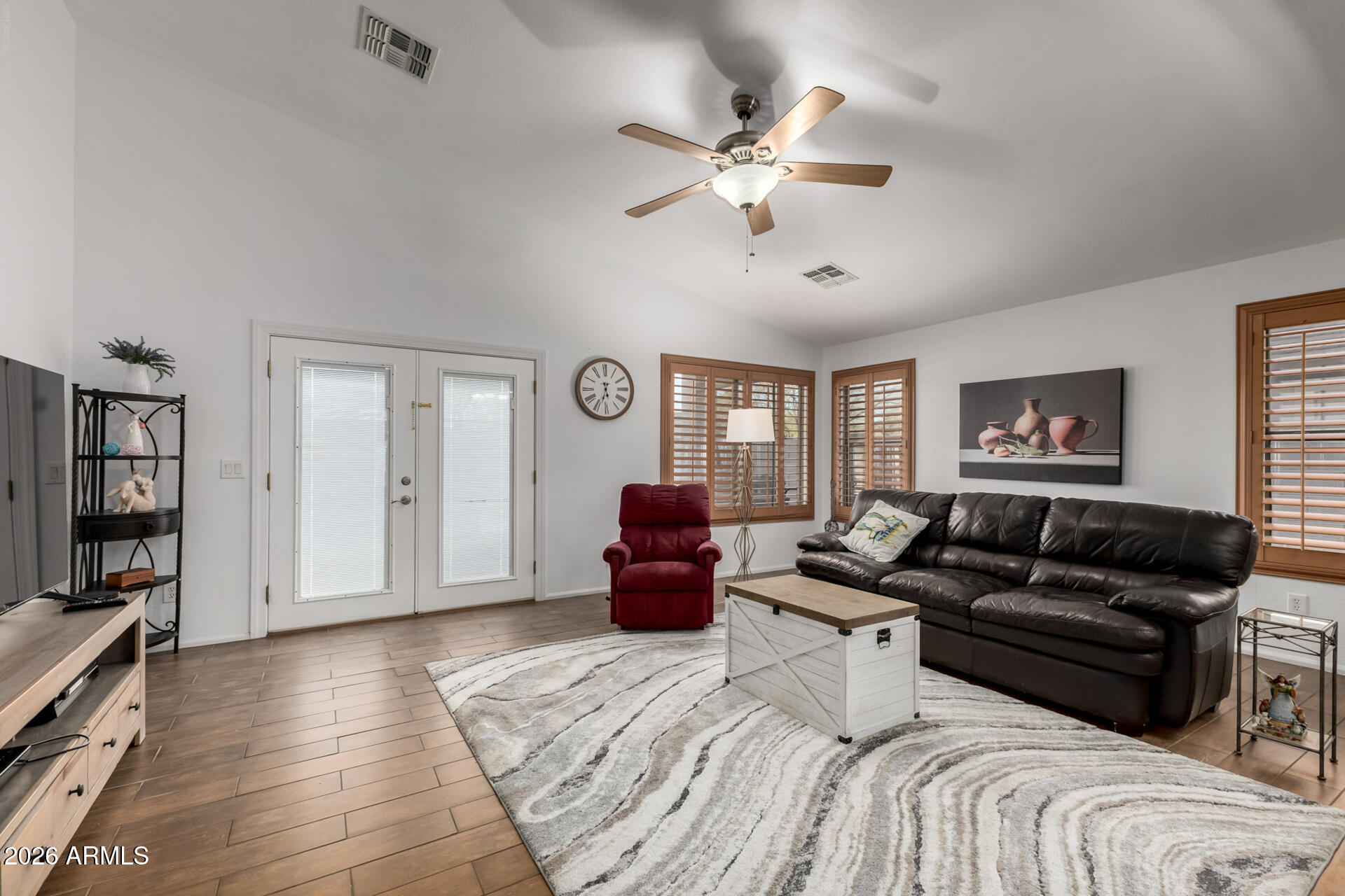 935 West Gascon Road San Tan Valley, AZ 85143 - Photo 10 of 43 a bedroom with a bed couch and a window
