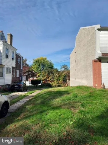 a view of a street with a building in the background