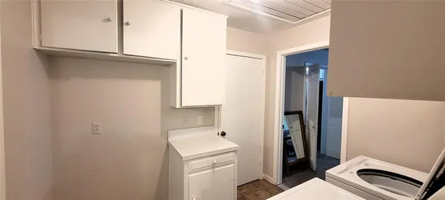 a bathroom with a toilet sink and a mirror