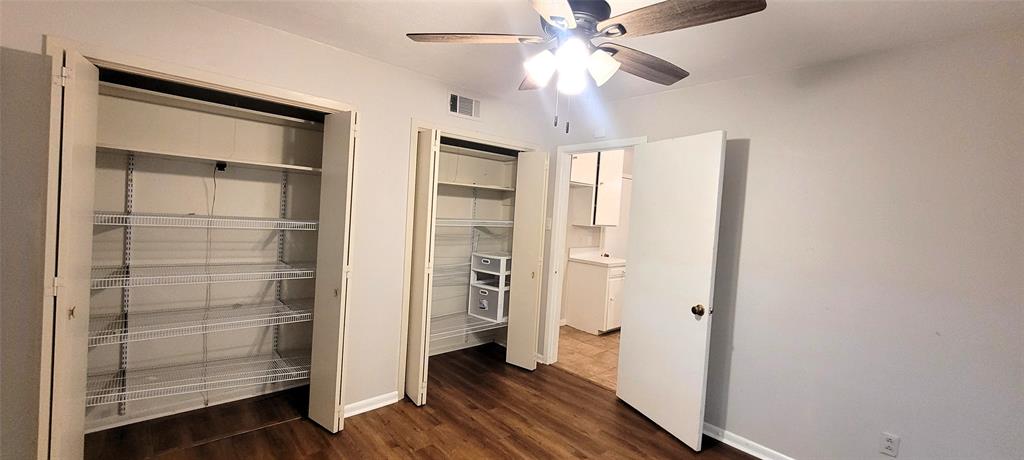204 Overhill Drive Waxahachie, TX 75165 - Photo 17 of 40 a view of a hallway with closet and wooden floor