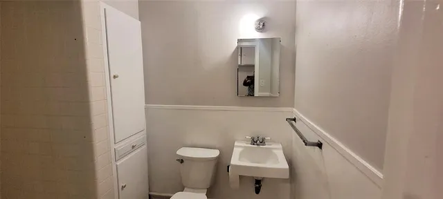 a bathroom with a sink toilet and tub
