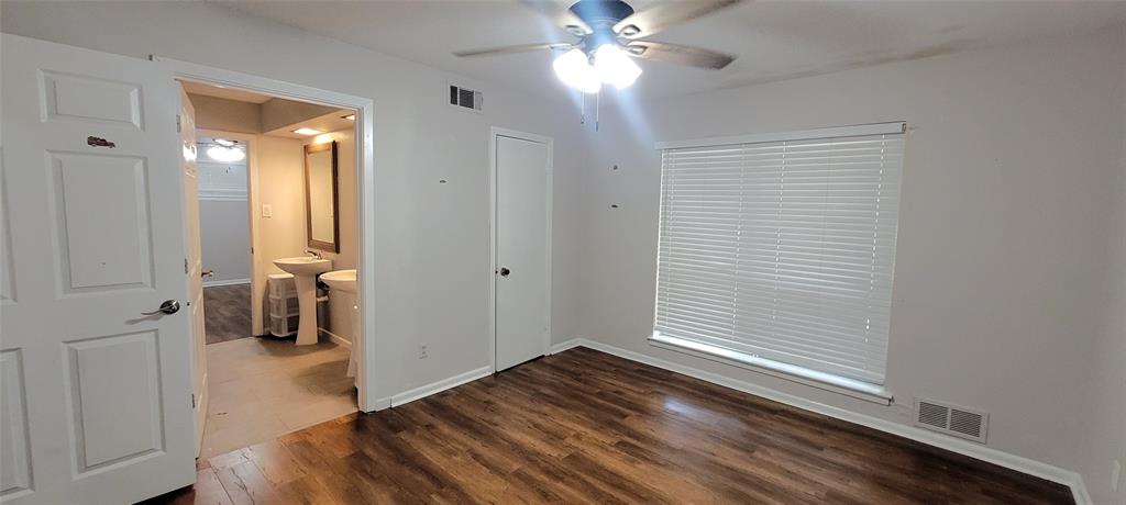 204 Overhill Drive Waxahachie, TX 75165 - Photo 20 of 40 wooden floor in an empty room with a window