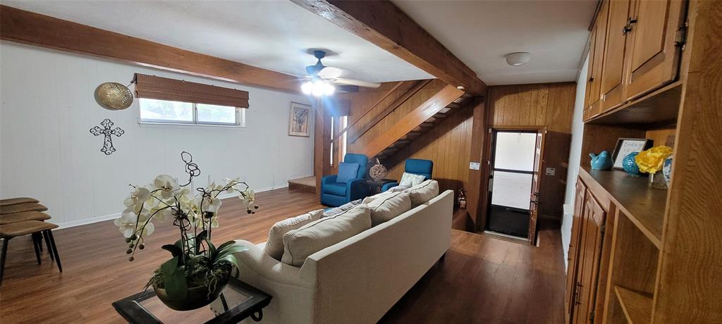 204 Overhill Drive Waxahachie, TX 75165 - Photo 31 of 40 a hallway with furniture and wooden floor