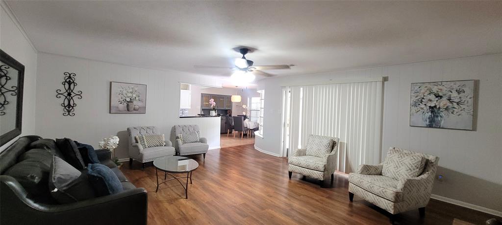 204 Overhill Drive Waxahachie, TX 75165 - Photo 6 of 40 a living room with furniture and a chandelier