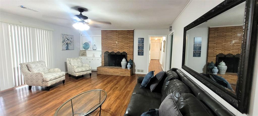 204 Overhill Drive Waxahachie, TX 75165 - Photo 7 of 40 a living room with furniture and a fireplace