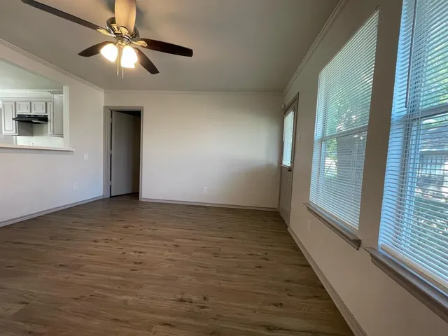 a view of an empty room with a window