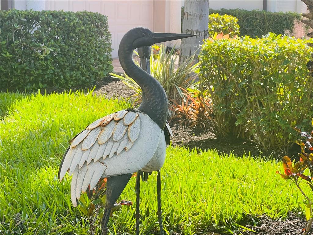 6574 Amarone Lane Naples, FL 34113 - Photo 15 of 44 a view of a fountain in the garden of statue