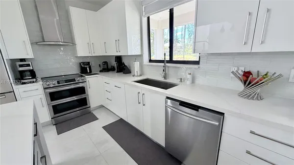 a living room with furniture or couch and a large window