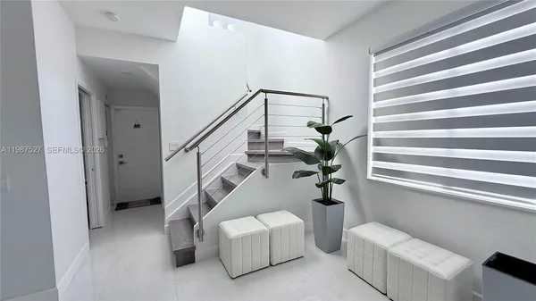 a view of a livingroom with furniture and window