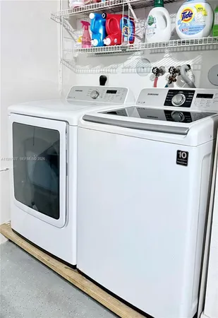 a bedroom with furniture and a potted plant