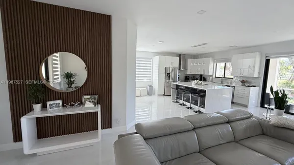a lobby with furniture and potted plants