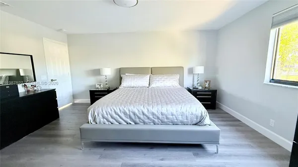 a bathroom with a sink vanity and mirror