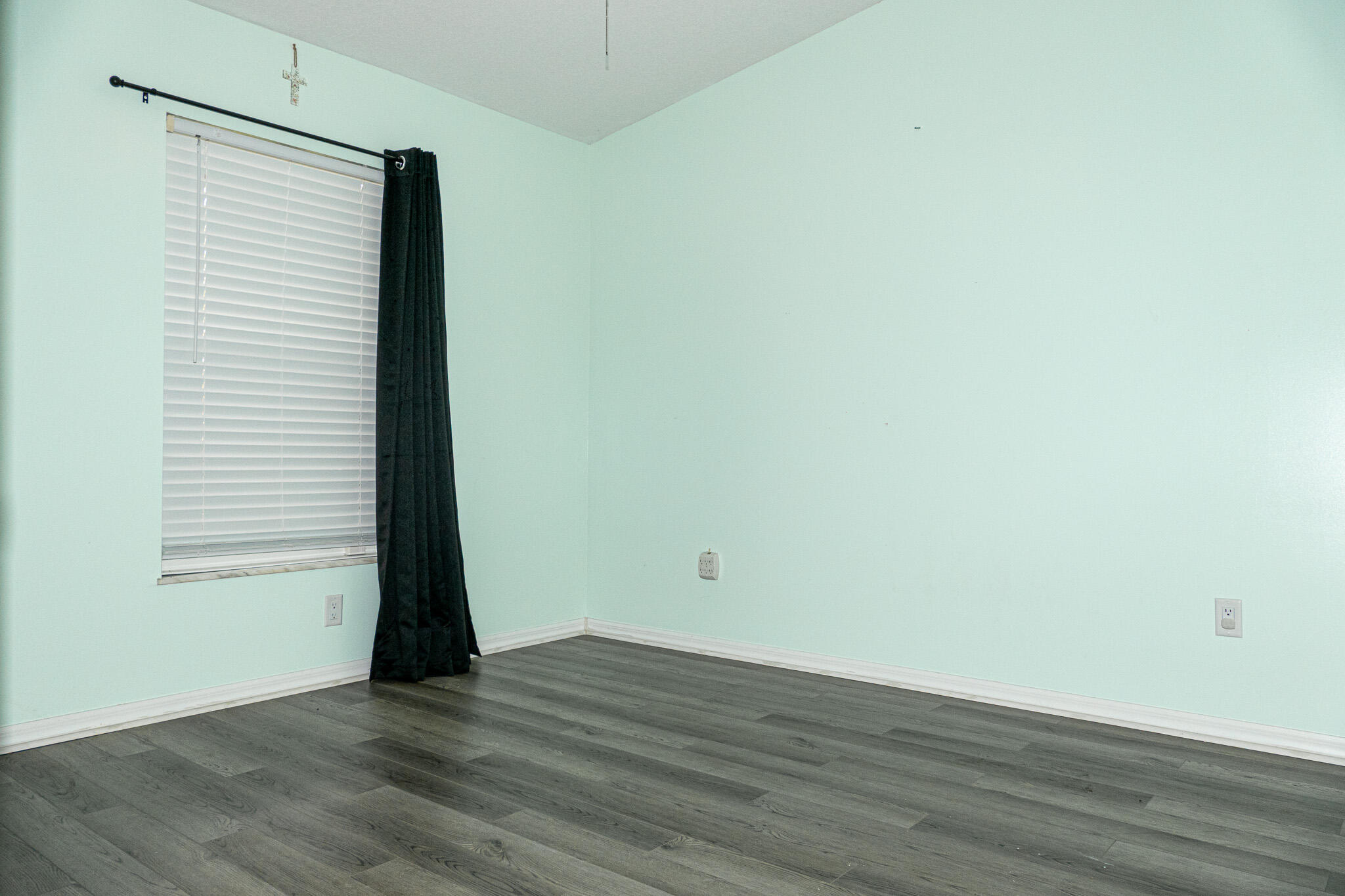 7685 Pleasant Ridge Court Stuart, FL 34997 - Photo 29 of 66 an empty room with wooden floor and a window