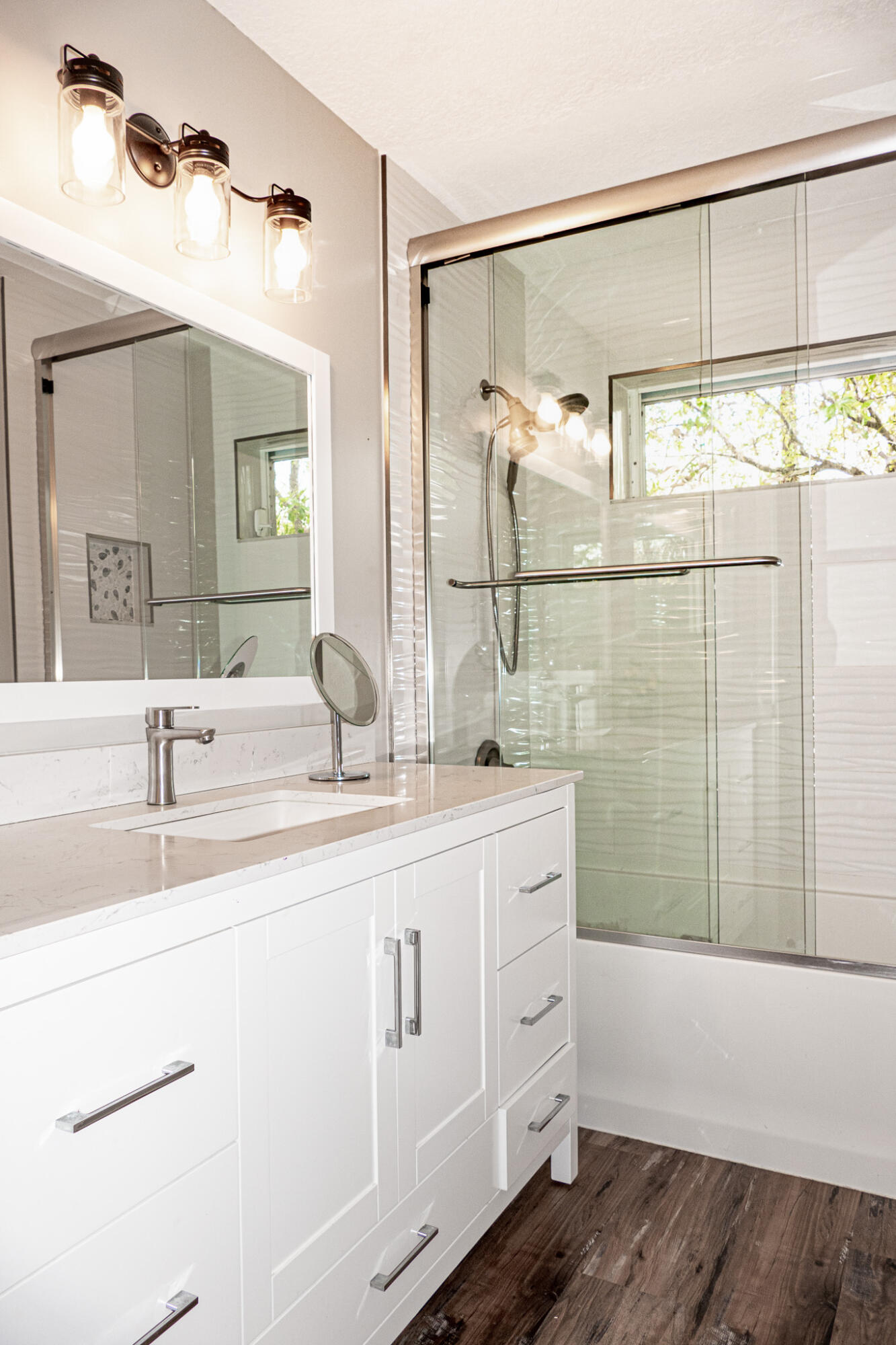 7685 Pleasant Ridge Court Stuart, FL 34997 - Photo 32 of 66 a bathroom with a double vanity sink a mirror and shower