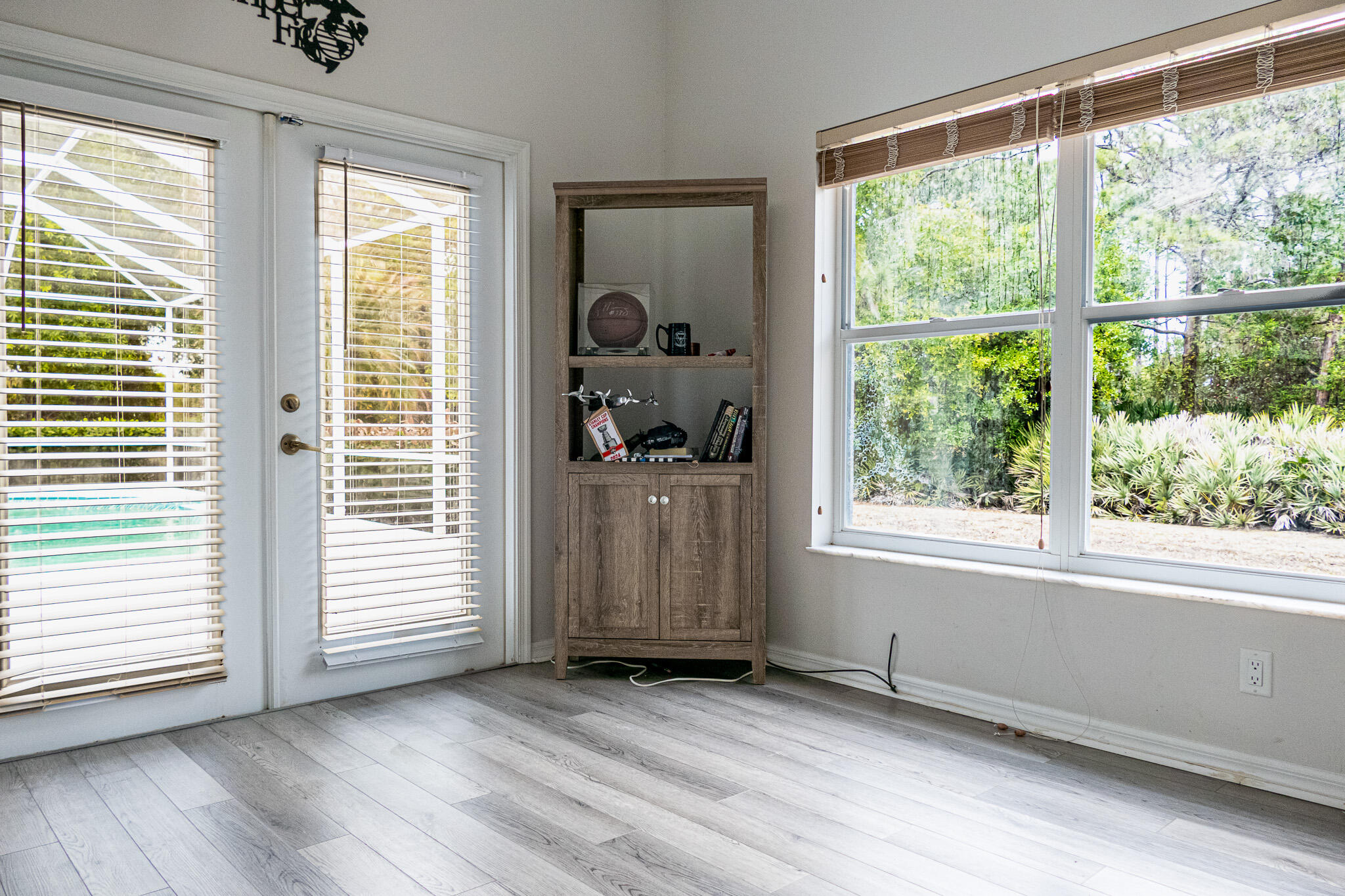 7685 Pleasant Ridge Court Stuart, FL 34997 - Photo 33 of 66 an empty room with wooden floor and windows