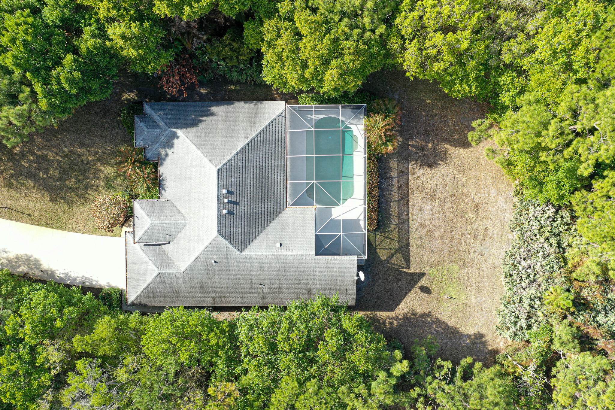 7685 Pleasant Ridge Court Stuart, FL 34997 - Photo 46 of 66 an aerial view of a house with a yard and large tree