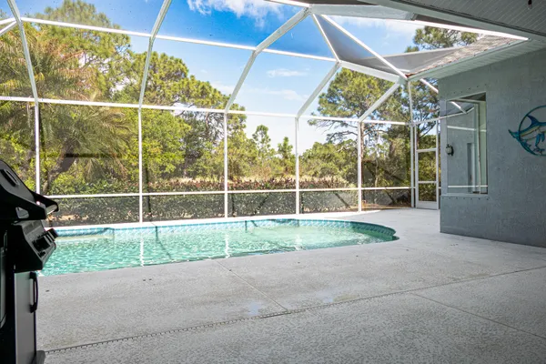 a view of yard with patio