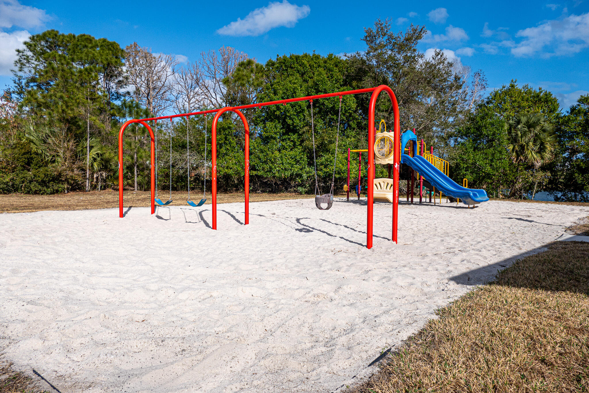 7685 Pleasant Ridge Court Stuart, FL 34997 - Photo 54 of 66 a view of a park with swings