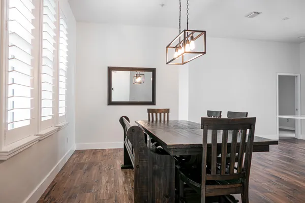 a view of a dining room with furniture window and wooden floor
