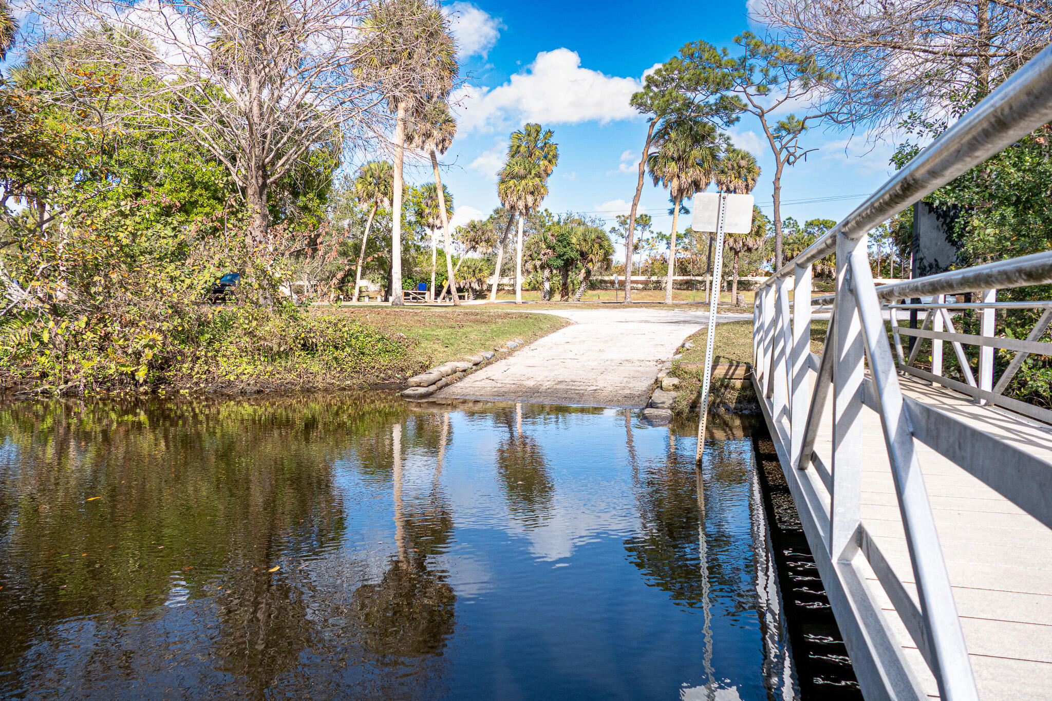 7685 Pleasant Ridge Court Stuart, FL 34997 - Photo 65 of 66 a view of swimming pool with outdoor seating and lake view