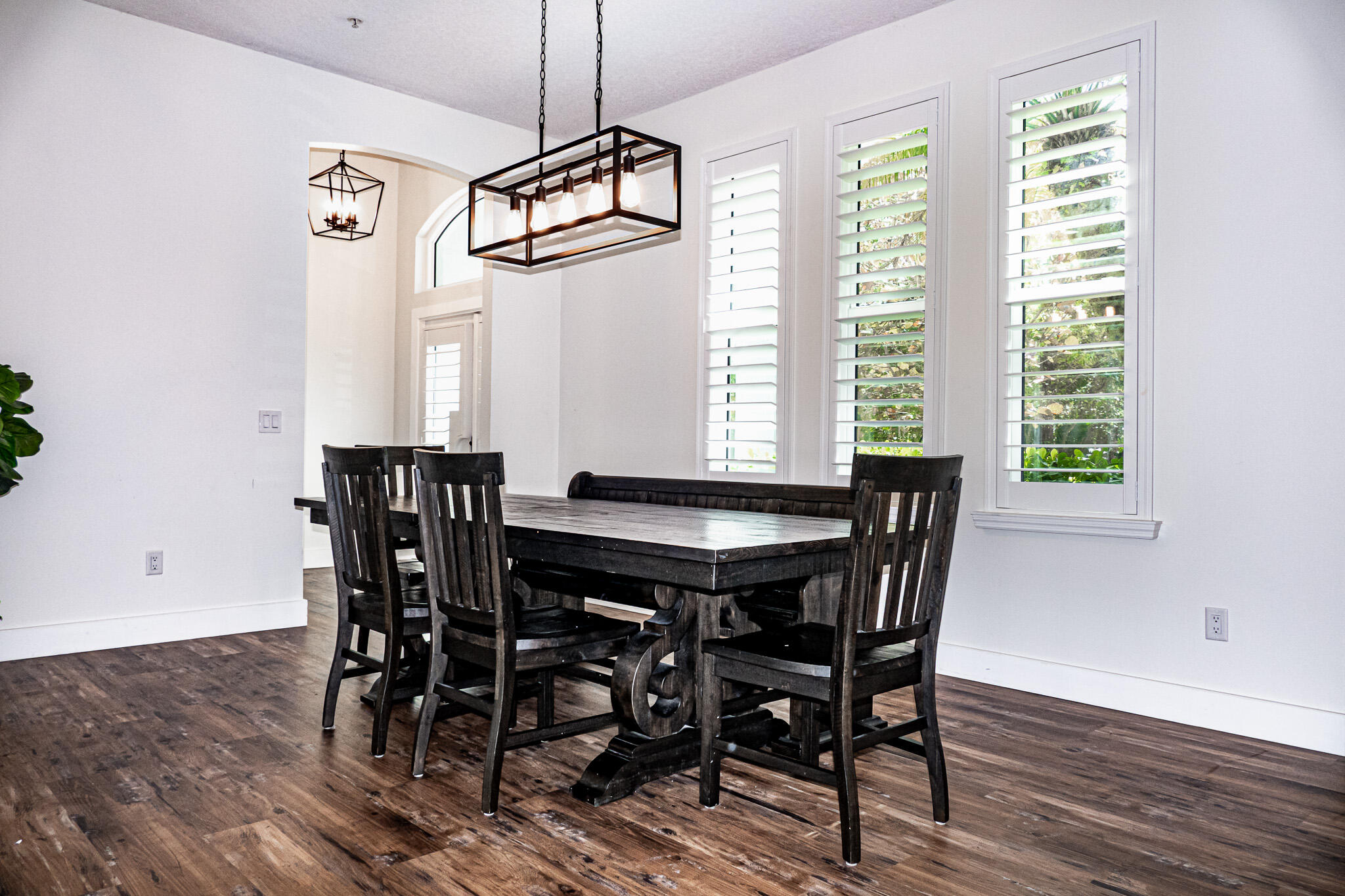 7685 Pleasant Ridge Court Stuart, FL 34997 - Photo 8 of 66 a view of a dining room with furniture window and wooden floor