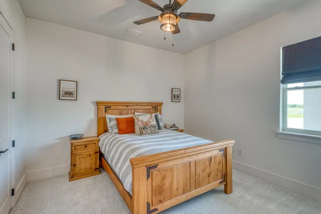 a bedroom with a bed and window